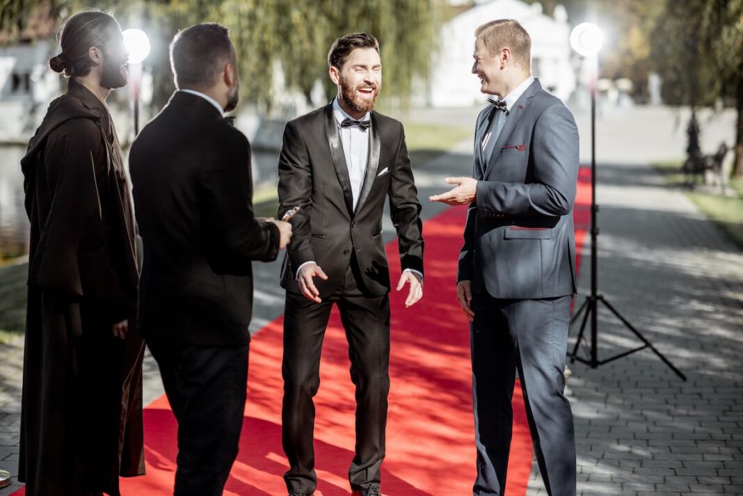 Movie actors on the red carpet outdoors